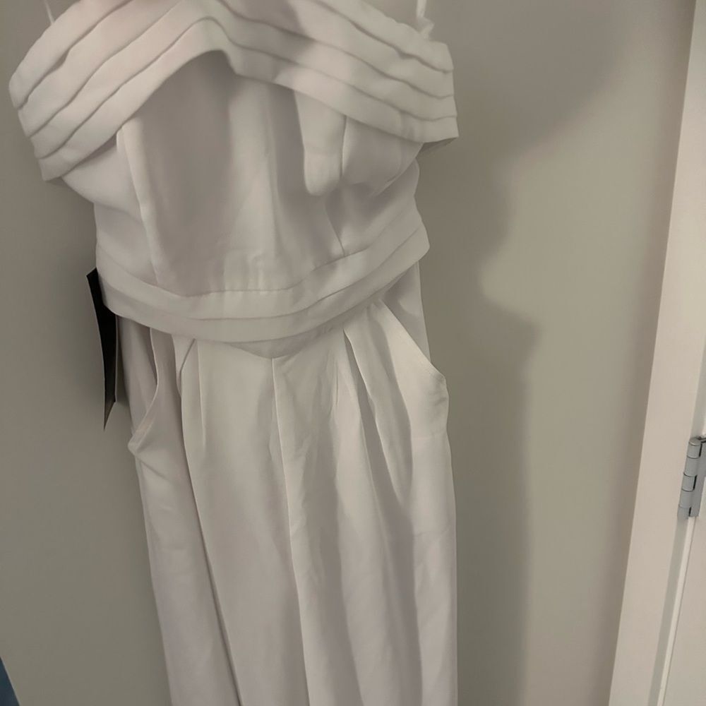 New Bebe jump suit never worn tag still attached​